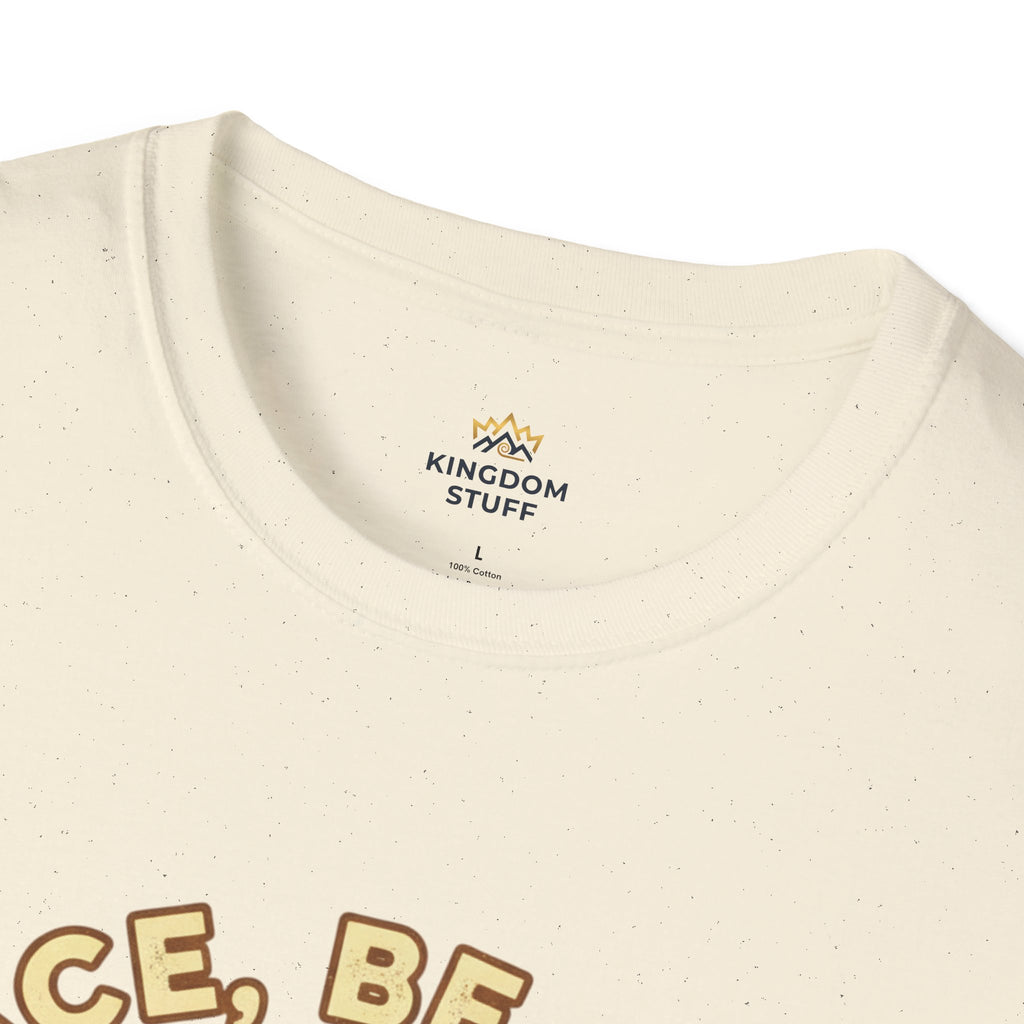 T-shirt featuring “Peace, Be Still”, sunrise detail and coffee detail and vintage lettering; strong conviction.