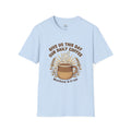 T-shirt featuring “Give Us This Day Our Daily Coffee”, coffee detail and bold lettering; calm strength.