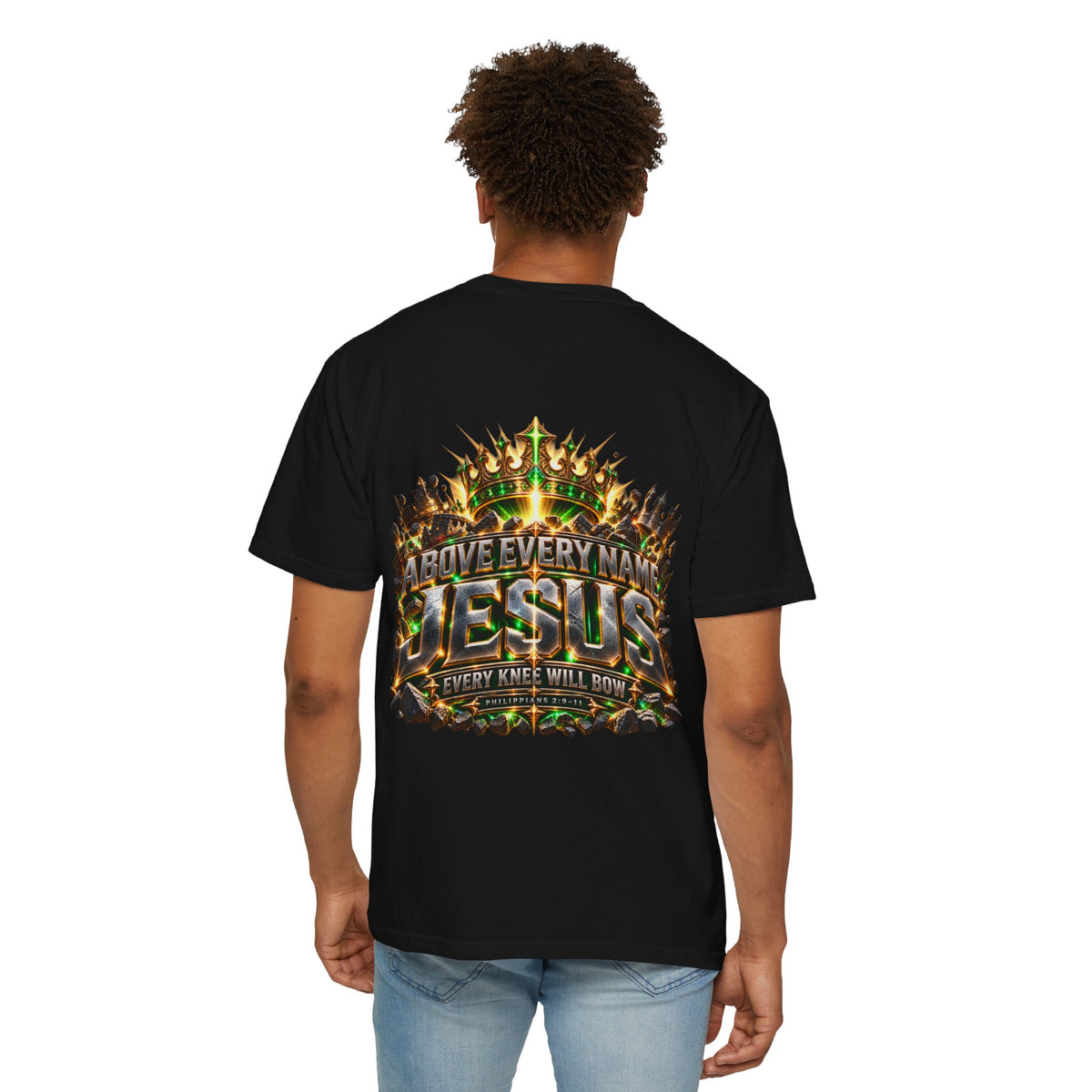 Black T-shirt featuring “Above Every Name Jesus”, crown imagery and  and forged-style lettering; hopeful spirit.