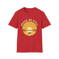 T-shirt featuring “Peace, Be Still”, sunrise detail and coffee detail and vintage lettering; grounded confidence.