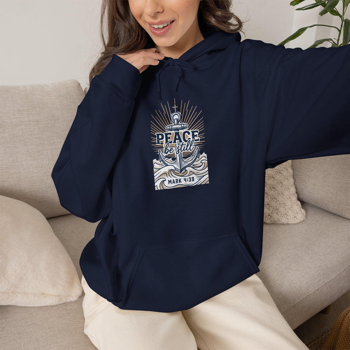 hoodie featuring “Peace Be Still”, anchor motif and  and rounded lettering; bold conviction.