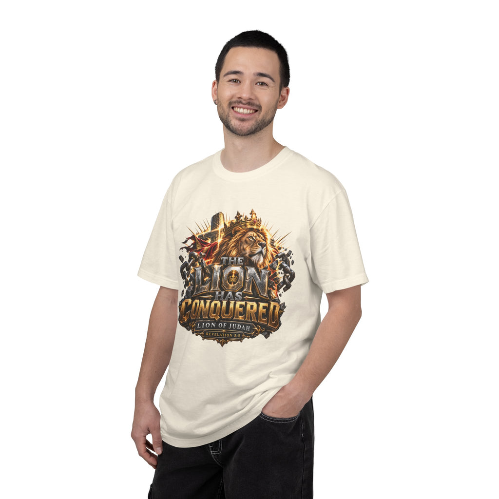 T-shirt featuring “Lion of Judah Conquered Graphic”, lion artwork and  and forged-style lettering; resilient faith.