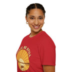 T-shirt featuring “Peace, Be Still”, sunrise detail and coffee detail and vintage lettering; faithful resolve.