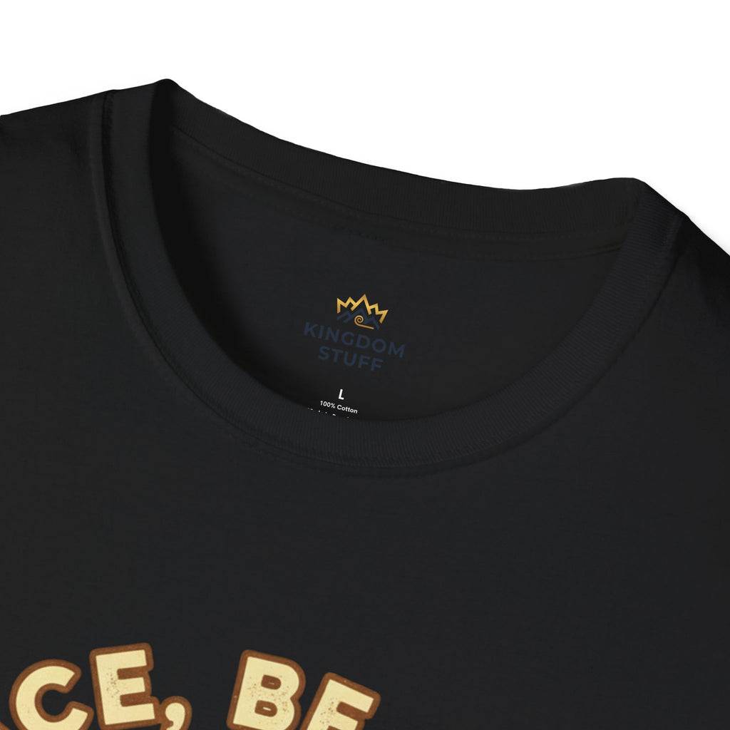 T-shirt featuring “Peace, Be Still”, sunrise detail and coffee detail and vintage lettering; resilient faith.